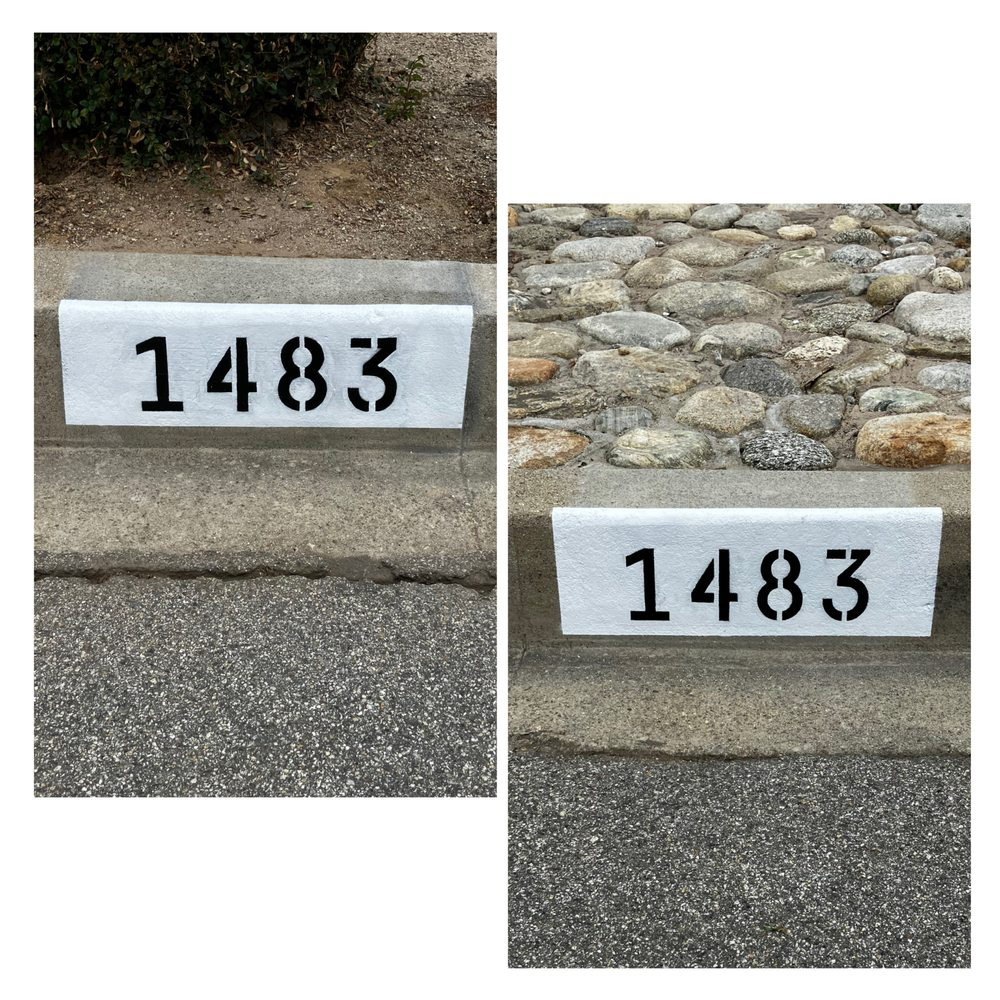 Before and after of a freshly painted 1483 curb address on a concrete curb